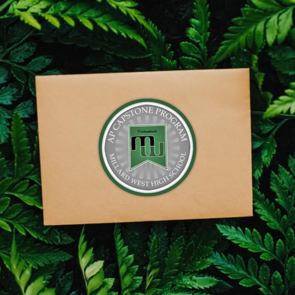 Brown envelope with the millard west logo