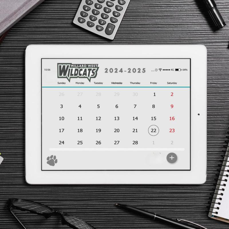 A tablet open to a calendar on a black desk