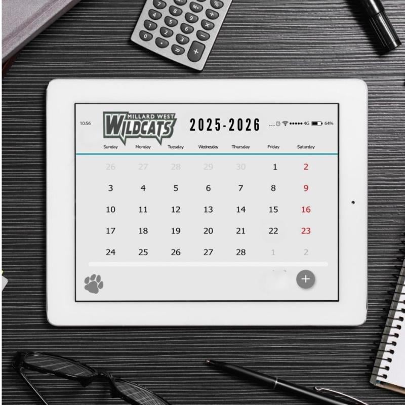 Tablet open to a calendar on a black tabletop 