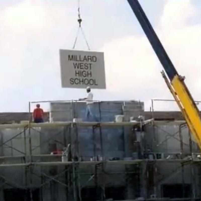 Putting up the sign